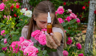 Allergy to flowers. Woman in the garden with a napkin allergy. Selective focus