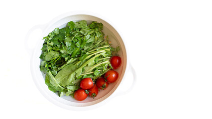 Fresh Harvest: Greens and Tomatoes Ready for Salad
