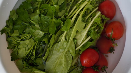 Nutrient Rich: A Bowl of Fresh Greens and Cherry Tomatoes
