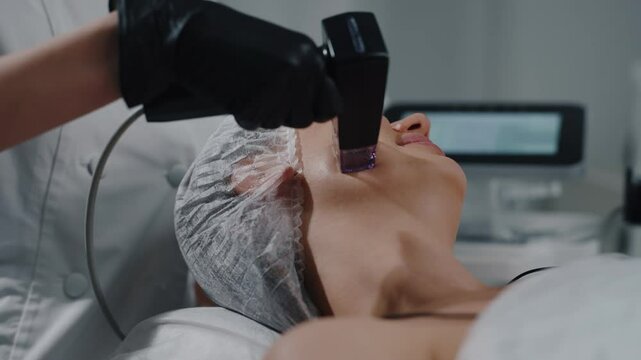 Microneedle RF facial treatment performed in cosmetic clinic