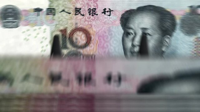 China money Chinese yuan renminbi counting machine with banknotes. Quick 10 CNY currency note down rotation. Business and economy concept loopable and seamless background.