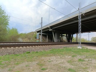 Two way railway tracks and bridge. Two railroad tracks. Concrete bridge. Cloudy day. Countryside....