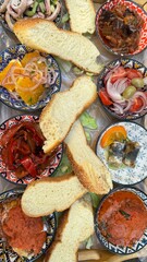 Healthy and homemade food for lunch with herb spread for bread. Paste made from vegetables, tomato and herbs. Slices of toast to eat. Vertical