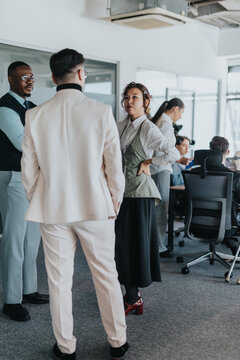 Fototapeta A diverse group of people engages in a lively discussion in a bright, modern office. The image showcases multicultural teamwork, collaboration, and interaction among colleagues.