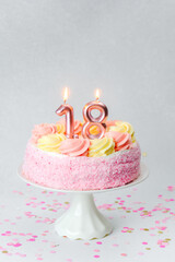 Birthday celebration cake with candles for turning eighteen years old