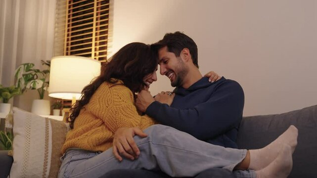 Loving couple hugging romantically together at home, happy in their relationship with deep affection and heartfelt reconciliation