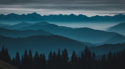 Obraz premium Blue mountain range and misty forest
