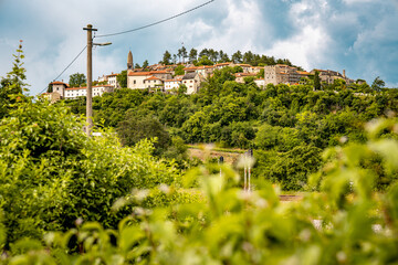 Scenic Hilltop Town Of Stanjel In Slovenia: Traditional Stone Houses And Historic Church Tower...