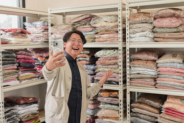 A man is taking a picture of himself in a store