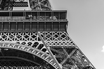 Monochrome Architectural Detail of Eiffel Tower's First Platform with Engraved Names