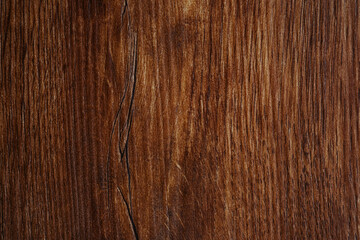Fototapeta premium Dark brown wood texture background with straight grain lines and natural finish