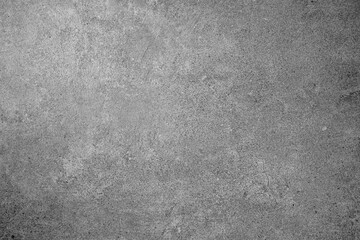 Rough gray concrete texture background with natural grain pattern and subtle surface cracks