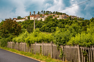 Scenic Hilltop Town Of Stanjel In Slovenia: Traditional Stone Houses And Historic Church Tower...