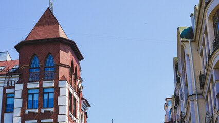 Ornate urban facade near a plaza, suitable for travel poster or decor prints