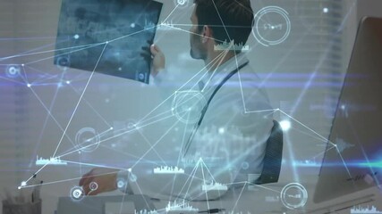 Doctor glancing at reports, lifting radiograph, tilting film under window blinds for health review - Powered by Adobe