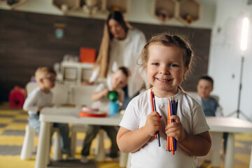 Children in kindergarten with their teacher