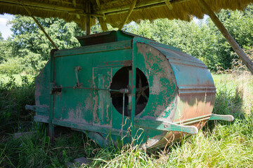 A green machine with a hole in the front
