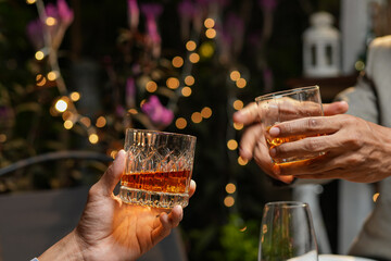 food and drink male friends are happy drinking beer and clinking glasses at a bar or pub.