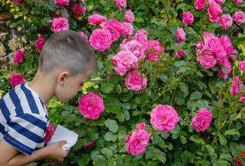 Child Sneezing from Flower Allergy. Selective focus