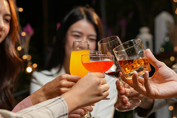 food and drink male friends are happy drinking beer and clinking glasses at a bar or pub.