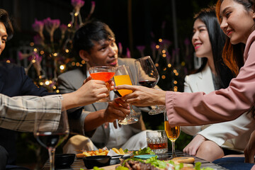 food and drink male friends are happy drinking beer and clinking glasses at a bar or pub.