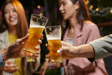 food and drink male friends are happy drinking beer and clinking glasses at a bar or pub.