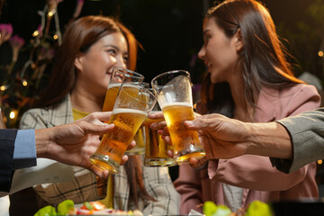 food and drink male friends are happy drinking beer and clinking glasses at a bar or pub.