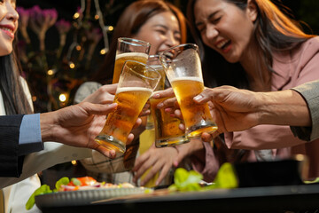food and drink male friends are happy drinking beer and clinking glasses at a bar or pub.