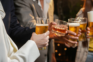 food and drink male friends are happy drinking beer and clinking glasses at a bar or pub.