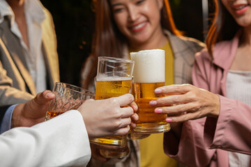 food and drink male friends are happy drinking beer and clinking glasses at a bar or pub.