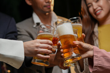 
food and drink male friends are happy drinking beer and clinking glasses at a bar or pub.