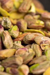 green pistachios for cooking , chopped into pieces crispy pistachios fried with salt, close up