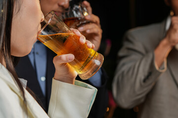  
food and drink male friends are happy drinking beer and clinking glasses at a bar or pub.