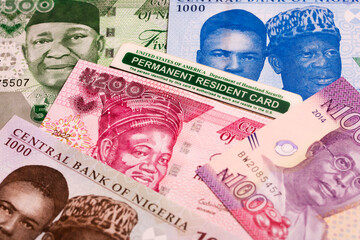Fototapeta premium American Permanent Resident Card on Nigerian Naira