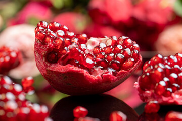 ripe red pomegranate, closeup fresh peeled pomegranate, side view