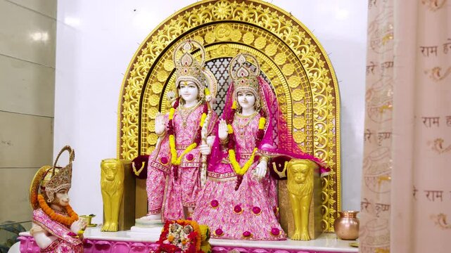 Cinematic view of the Hindu deity Lord Rama and Sita with Hanuman, Interior view of an Indian temple of Lord Rama.