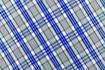 Checkered blue fabric. Textile. Checkered fabric background with blue and white cells