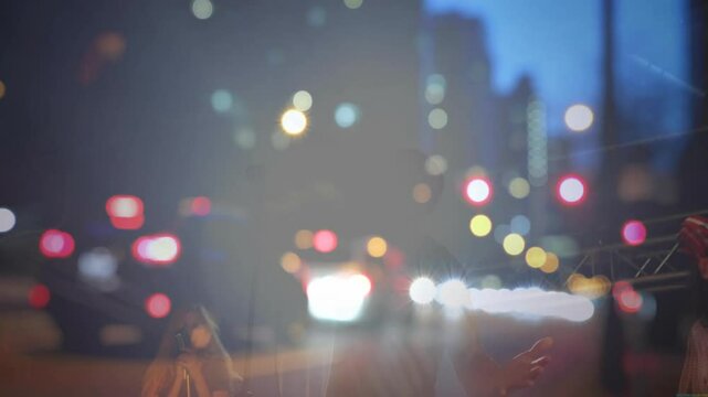 Lead singer grabbing mic, singing in concert while city bokeh drifting, backing vocalists clapping