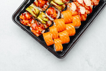 Sushi platter with assorted rolls and fresh salmon slices ready to enjoy