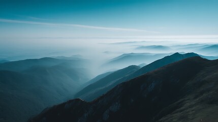Misty mountain layers in blue hues