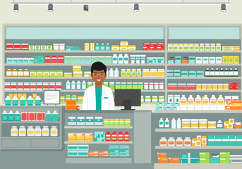 Pharmacy interior with a smiling pharmacist standing behind a counter with shelves stocked with colorful medication boxes