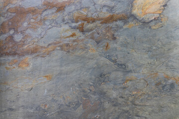 Abstract Stone Background, Weathered Rock Surface with Earthy Hues and Veining