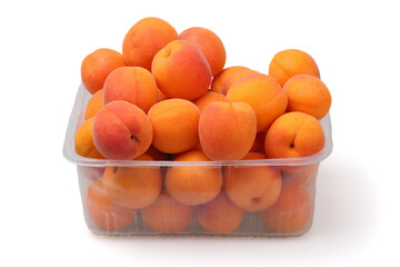 A container of apricots purchased from a grocery store.