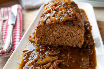 Delicious meatloaf with brown onion sauce fresh and homemade cooked