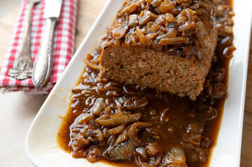 Delicious meatloaf with brown onion sauce fresh and homemade cooked