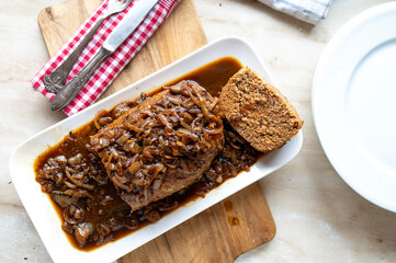 Delicious meatloaf with brown onion sauce fresh and homemade cooked
