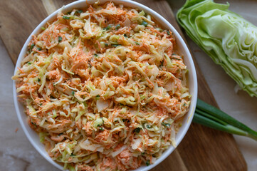 Coleslaw with pointed cabbage and carrots with a light salad dressing fresh and homemade prepared