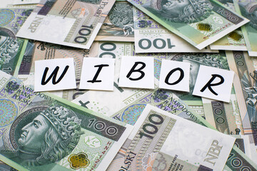 Inscription WIBOR next to polish money. WIBOR is Warsaw Interbank Offered Rate