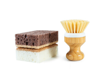 White and brown sponges and brush for washing dishes. Isolated on white.