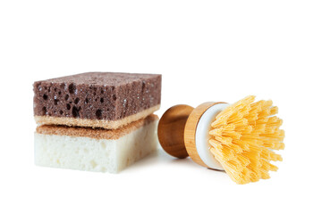 White and brown sponges and brush for washing dishes. Isolated on white.